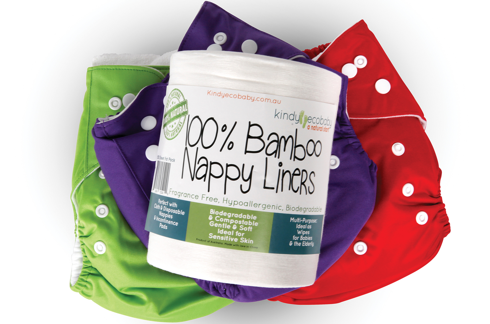 A roll of Kindy Ecobaby bamboo nappy liners lying face up on three modern nappies, one is purple, another is red and the third is green