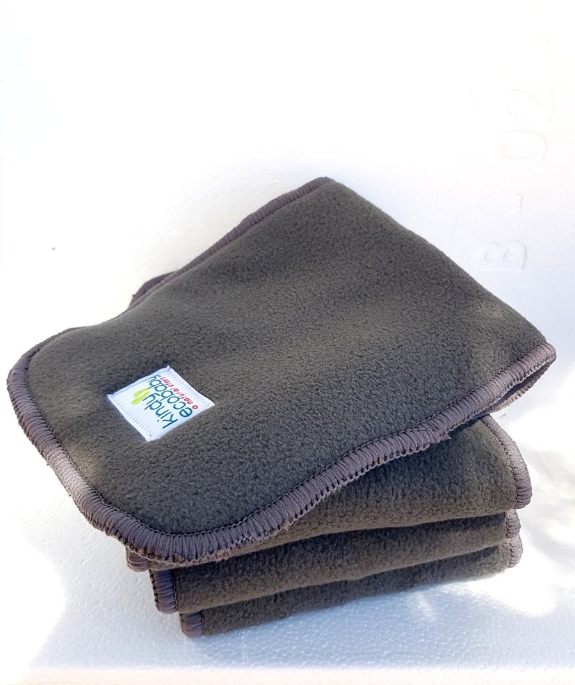 A pile of Kindy Ecobaby Charcoal and Microfiber Cloth Nappy Booster Inserts agains a white background