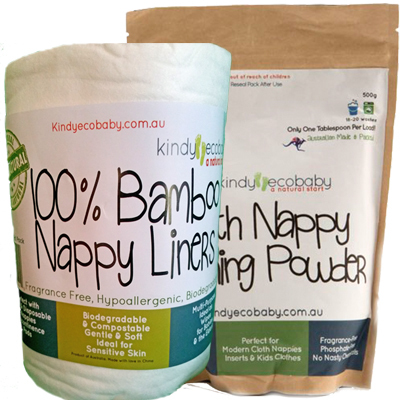 A roll of Kindyecbaby nappy liners next to a pack of Kindy Ecobaby cloth nappy washing powder. The pack of washing powder is brown and both are labelled with the Kindy Ecobaby brand