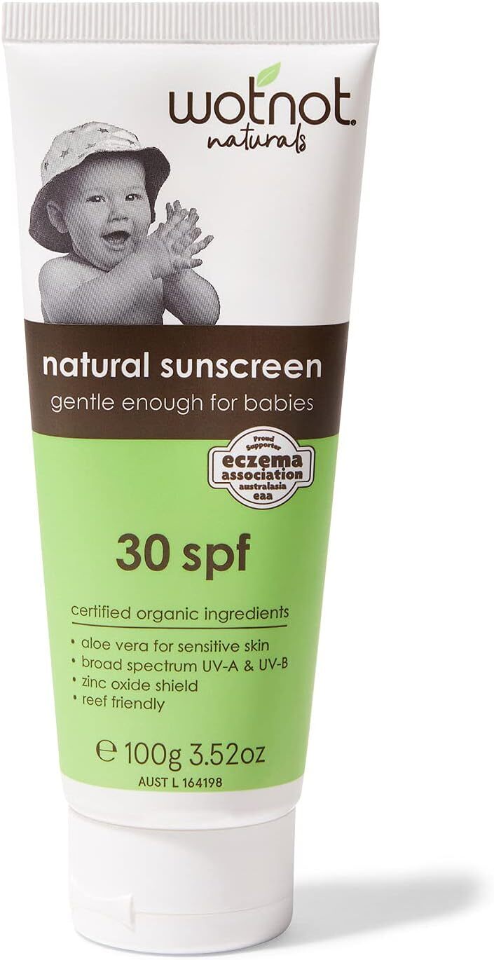 A tube of Wotnot Natural Sunscreen, with a happy baby clapping his hands on it and wearing a hat , emphasizing its suitability for sensitive skin with organic, chemical-free ingredients and broad-spectrum protection.